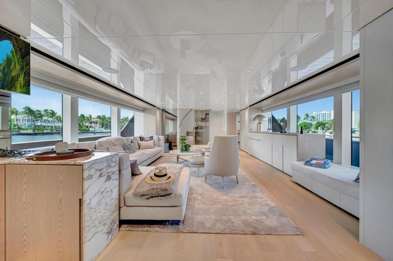 a living room with a large window aboard JICJ Yacht for Sale