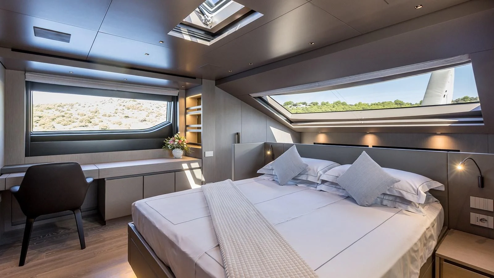 a room with a bed and a chair aboard JICJ Yacht for Sale