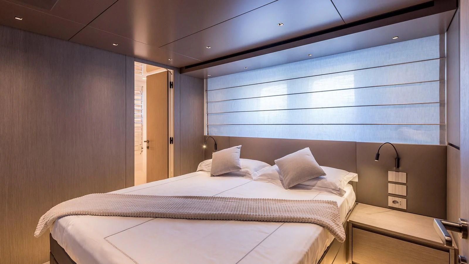 a bed with white sheets aboard JICJ Yacht for Sale