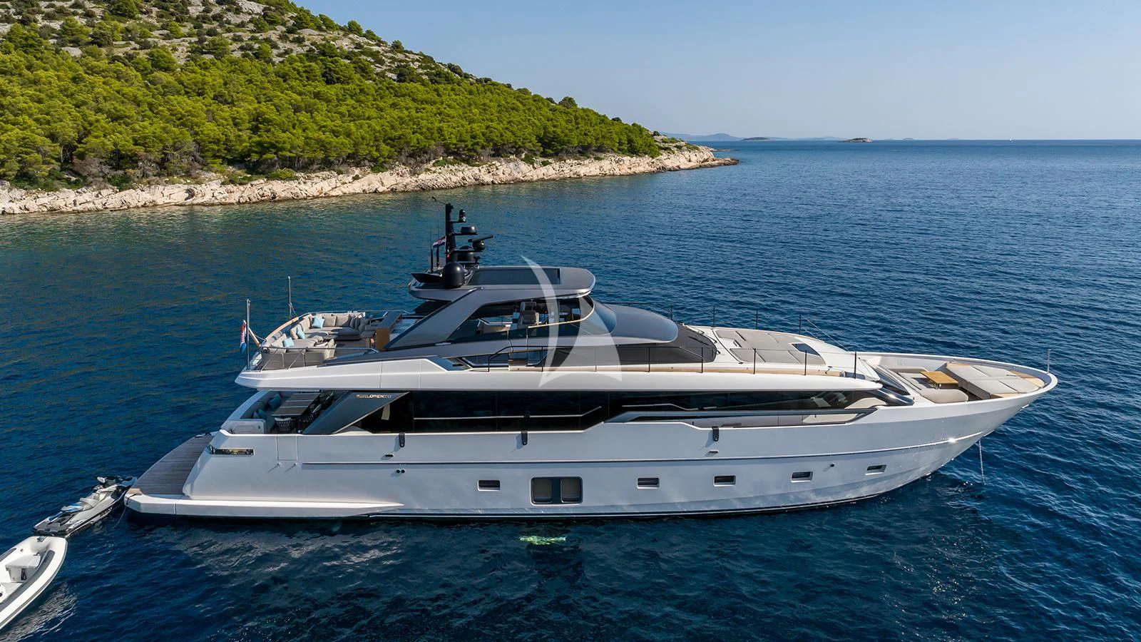 a white yacht on the water aboard JICJ Yacht for Sale