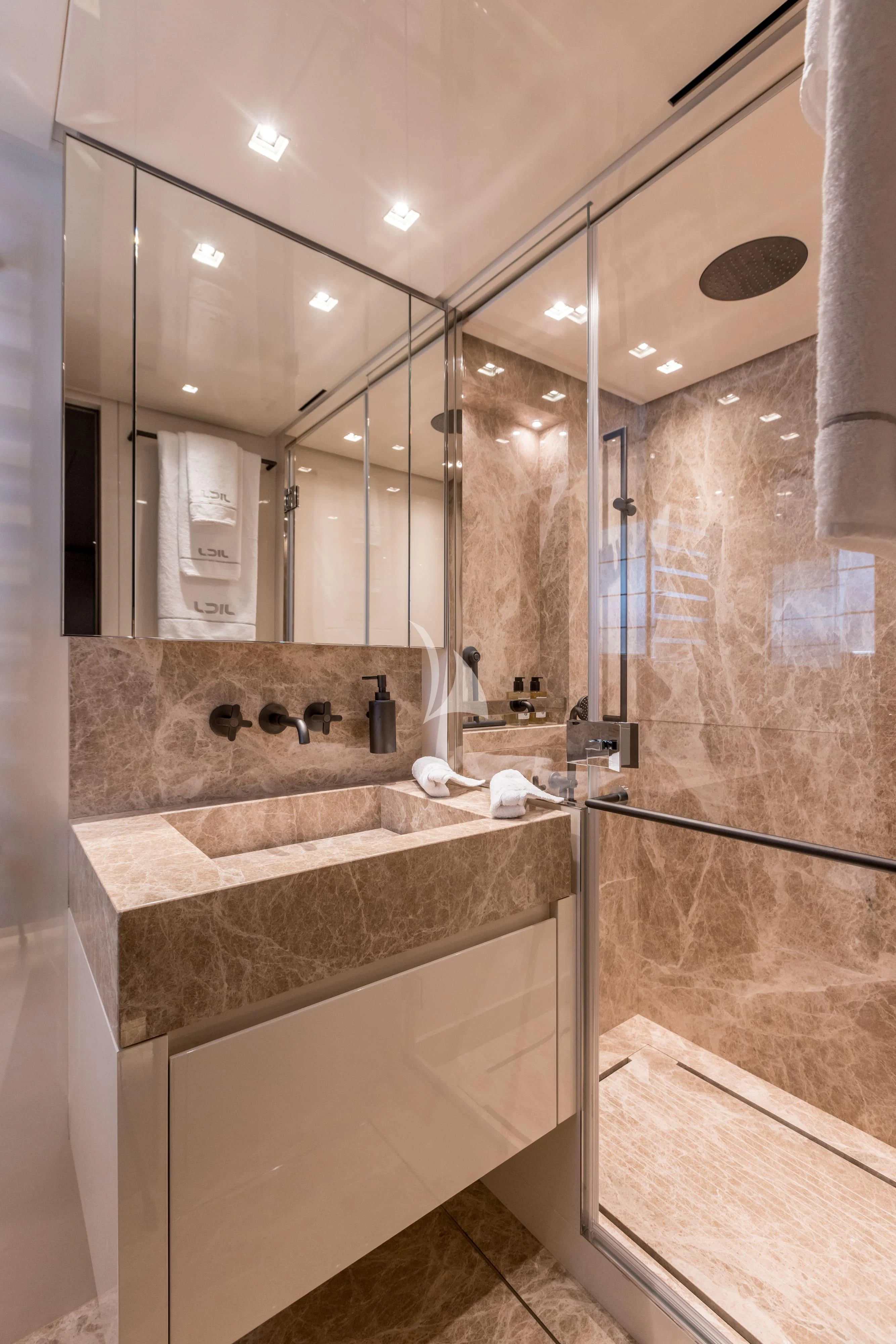a bathroom with a marble counter top aboard JICJ Yacht for Sale