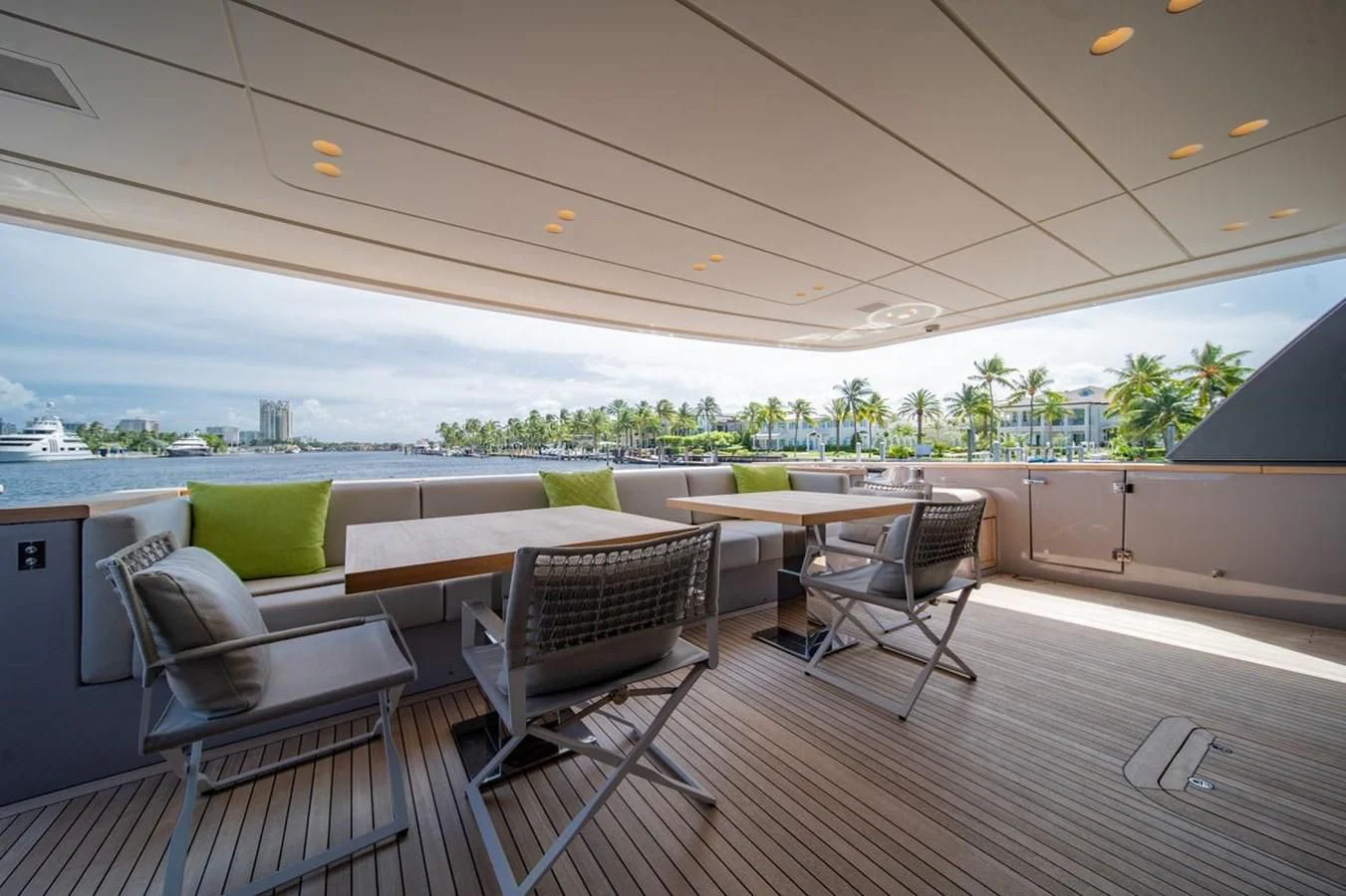 a room with a table chairs and a large window aboard JICJ Yacht for Sale