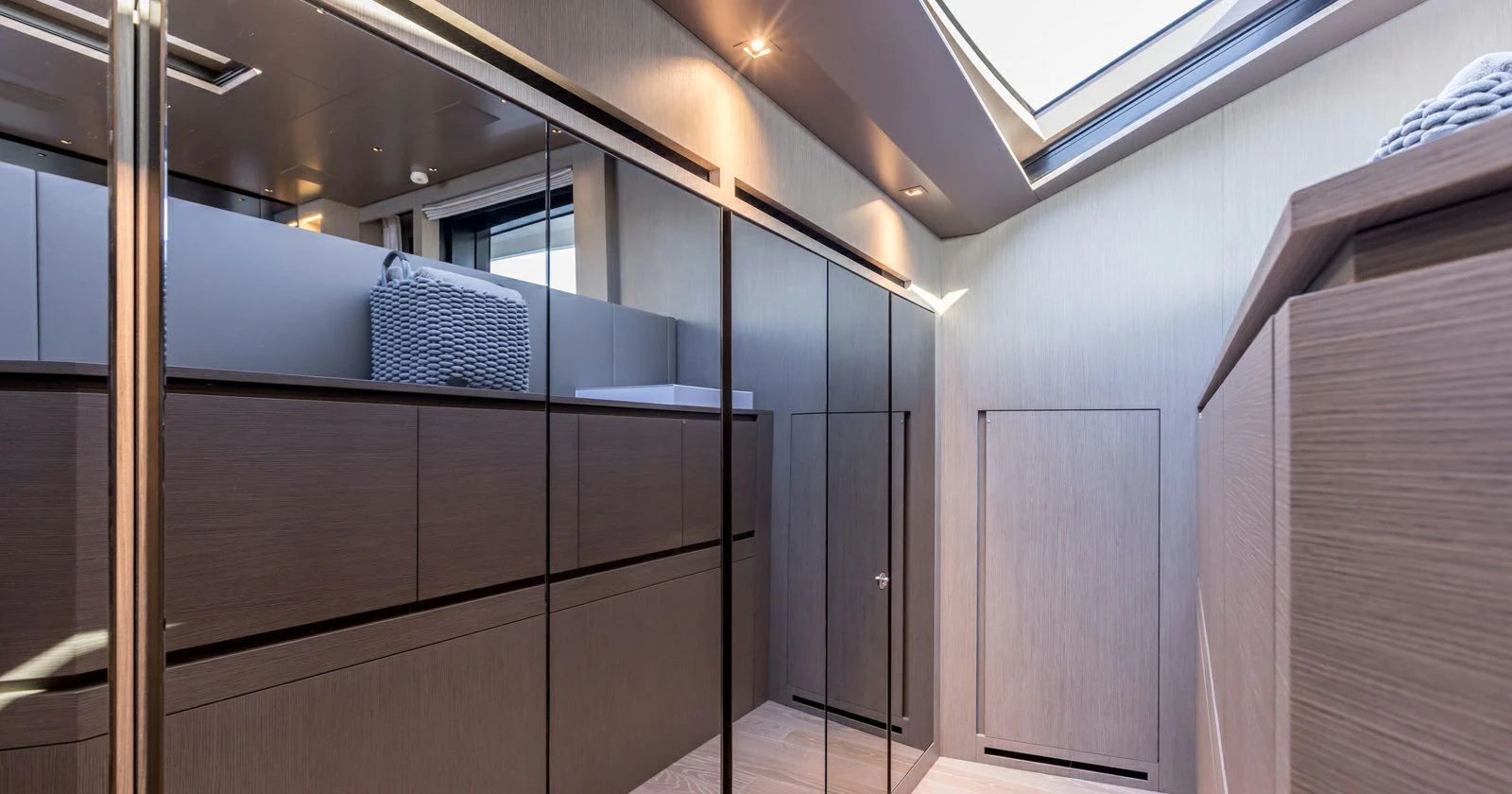 a room with a closet and a bed aboard JICJ Yacht for Sale
