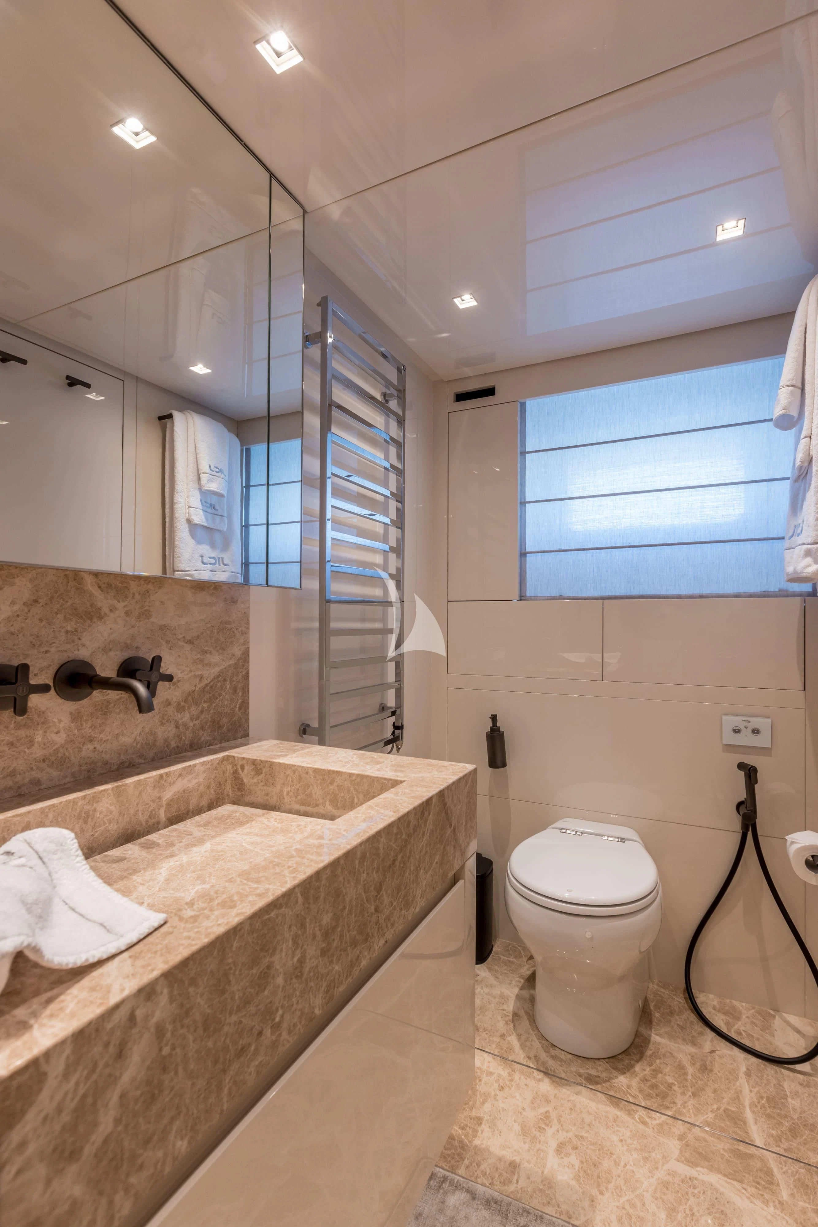 a bathroom with a marble counter top aboard JICJ Yacht for Sale