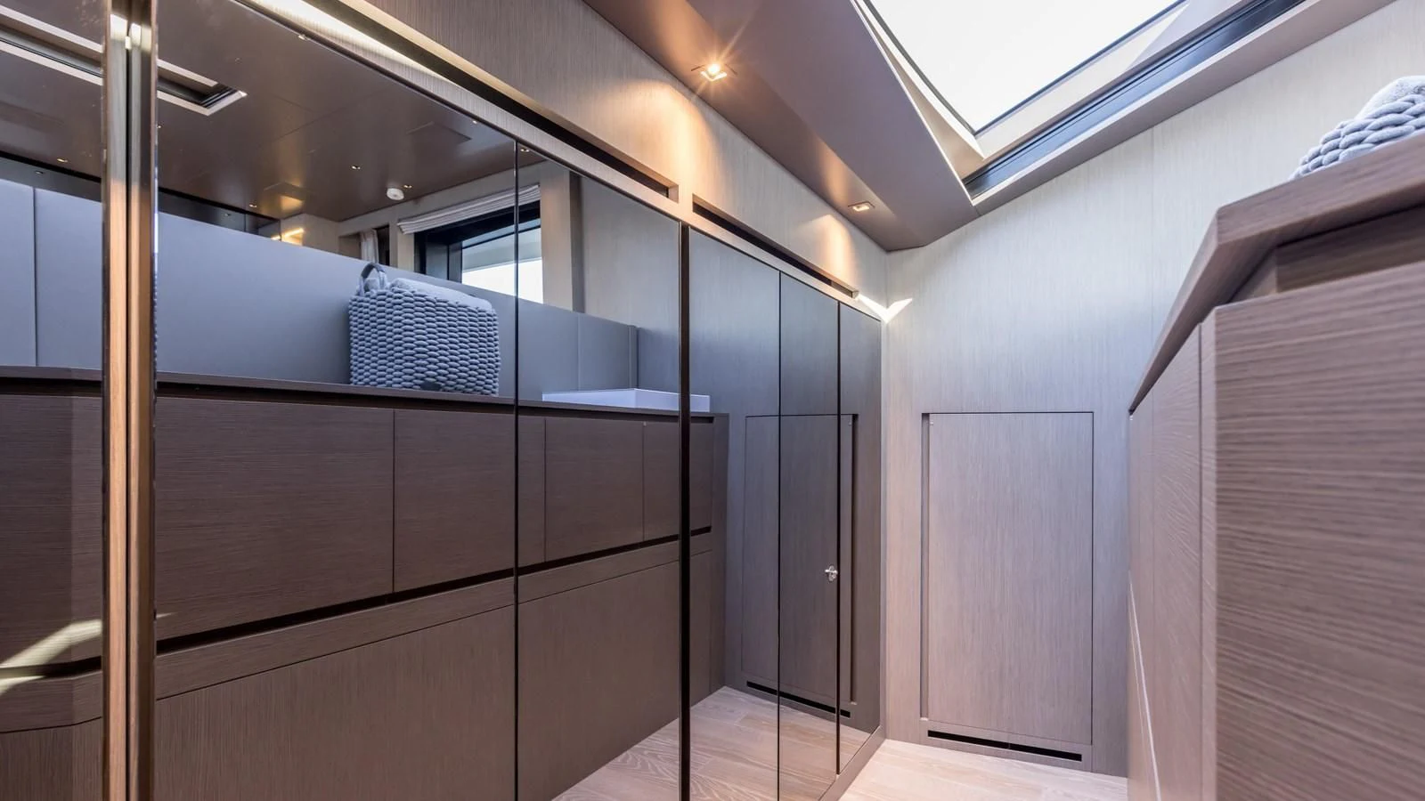 a room with a bed and a closet aboard JICJ Yacht for Sale