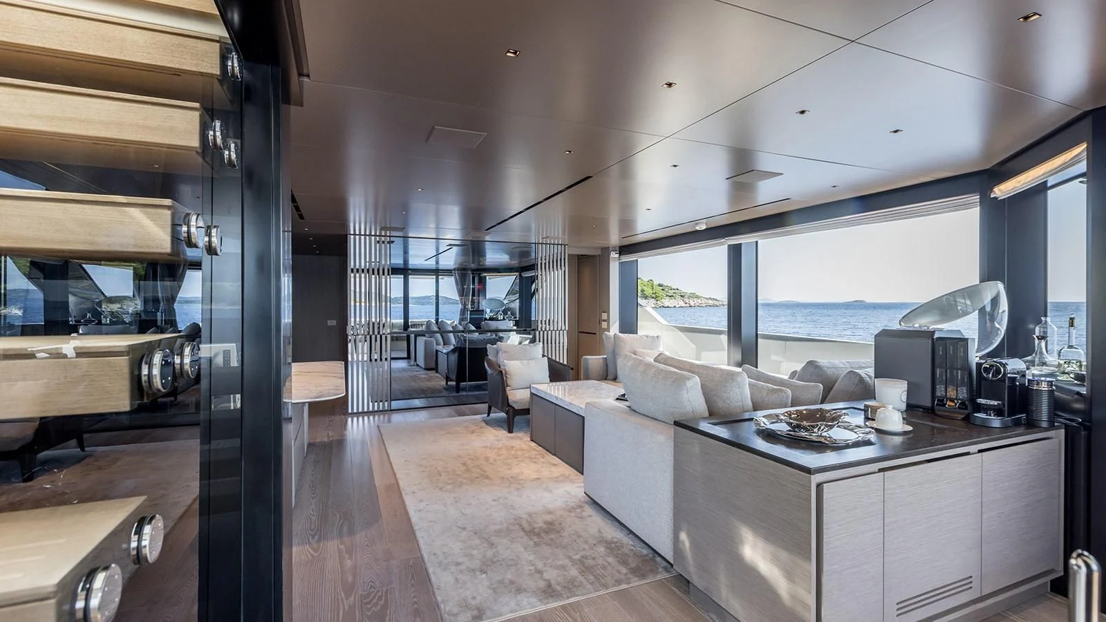 a large living room with a large window aboard JICJ Yacht for Sale