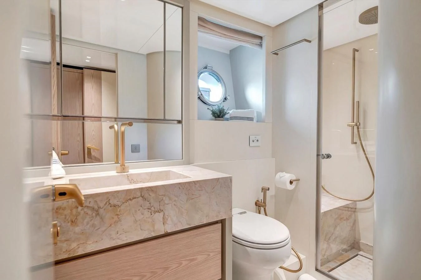a bathroom with a marble counter top aboard JICJ Yacht for Sale