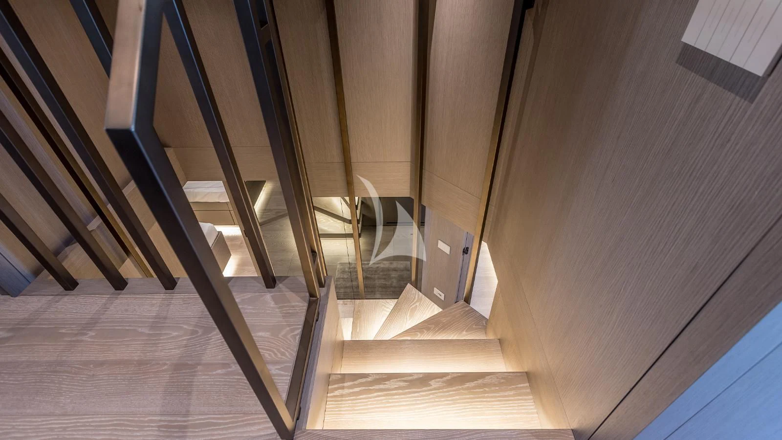 a wooden staircase with a railing aboard JICJ Yacht for Sale