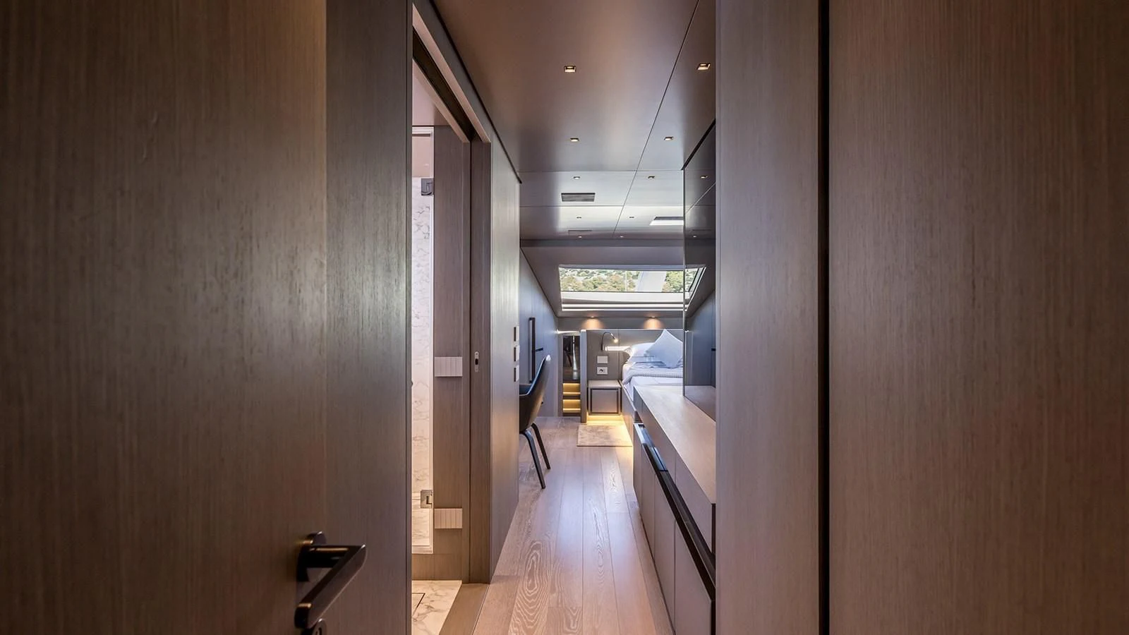 a hallway with a wood floor and a wood door aboard JICJ Yacht for Sale