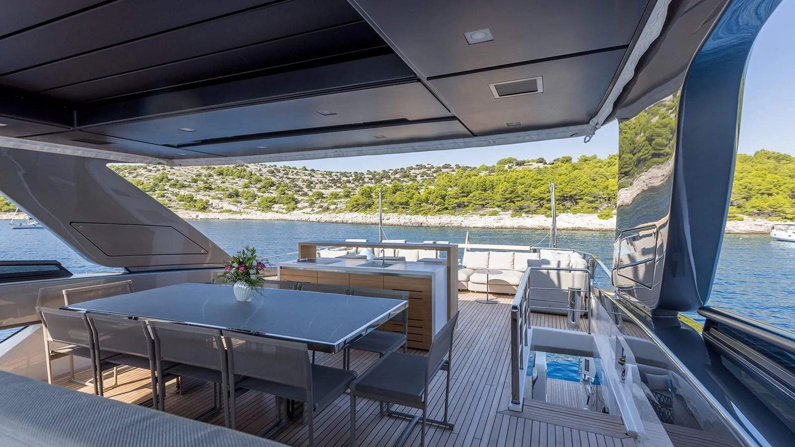a table and chairs on a boat aboard JICJ Yacht for Sale