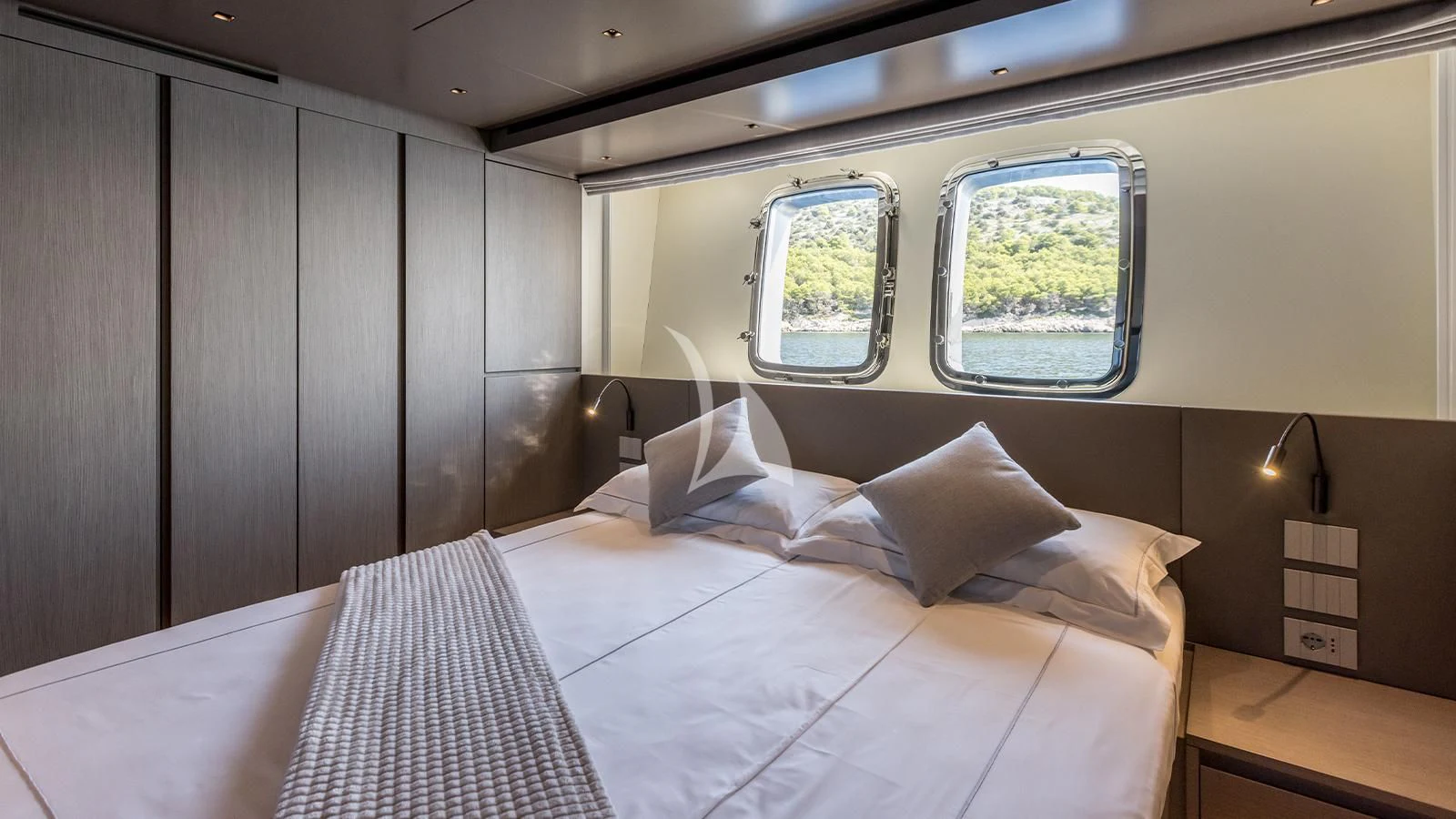 a bed with white sheets aboard JICJ Yacht for Sale