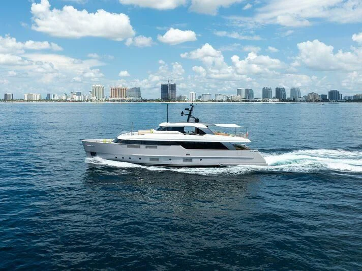 a white yacht on the water aboard JICJ Yacht for Sale