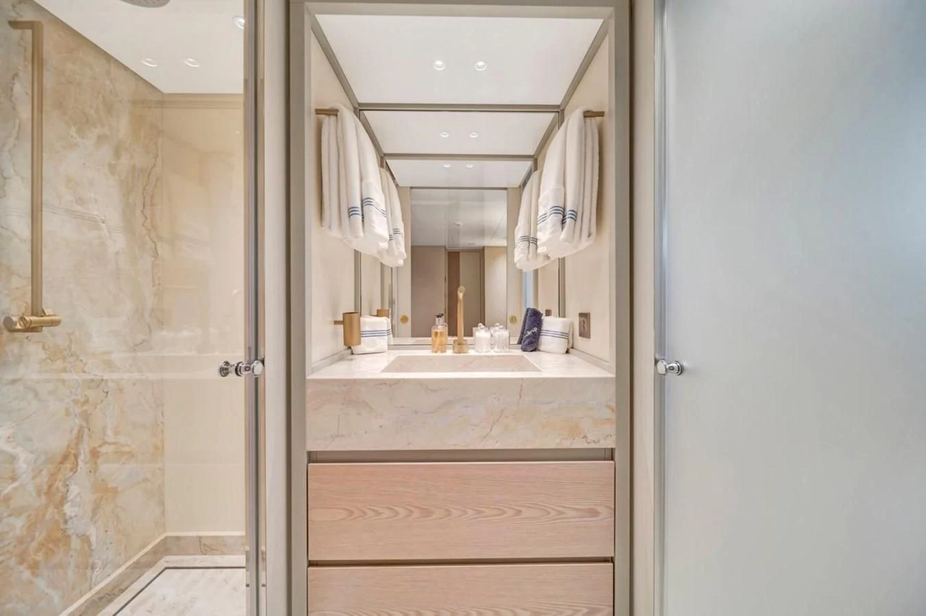 a bathroom with a sink and a mirror aboard JICJ Yacht for Sale