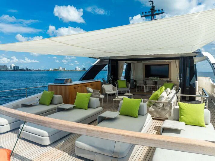 a deck with a view of the ocean and the ocean aboard JICJ Yacht for Sale