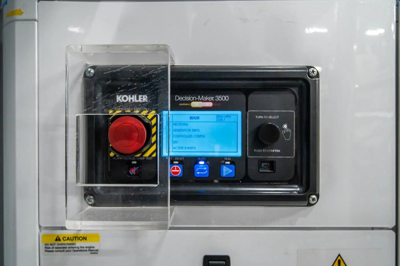 a white box with a black box with buttons and a red light aboard JICJ Yacht for Sale