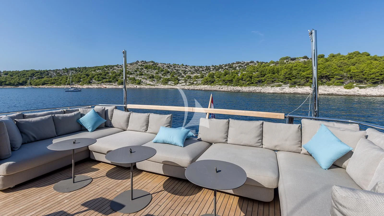 a couch with a table on it aboard JICJ Yacht for Sale
