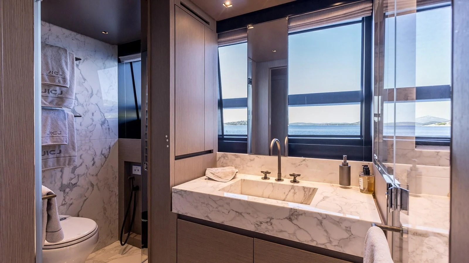 a bathroom with a large window aboard JICJ Yacht for Sale
