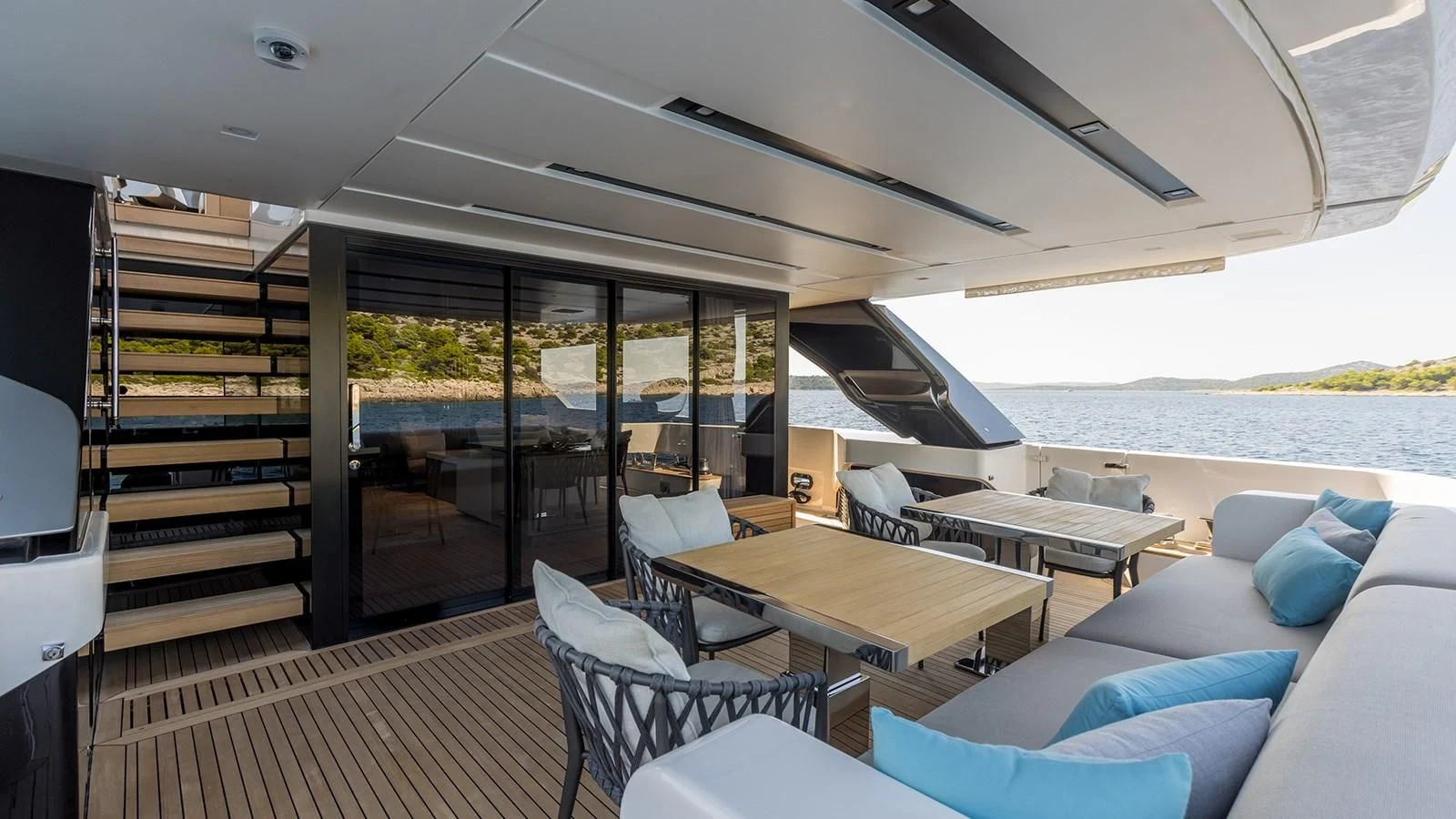 a living room with a table and chairs aboard JICJ Yacht for Sale
