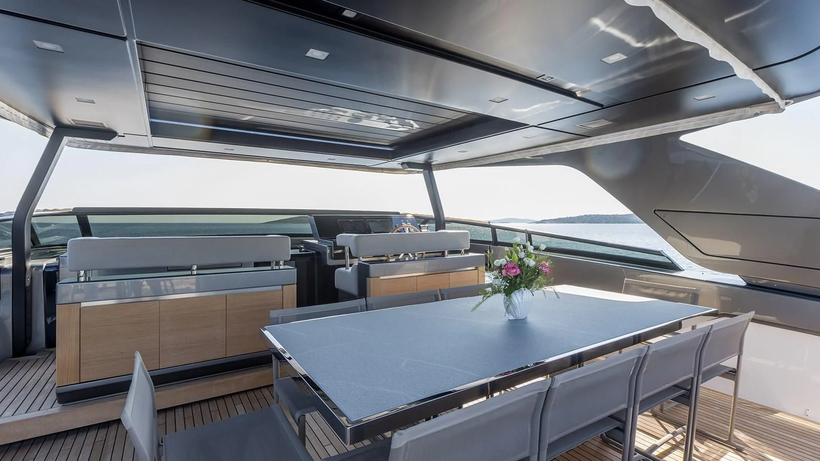 a room with a table and chairs aboard JICJ Yacht for Sale