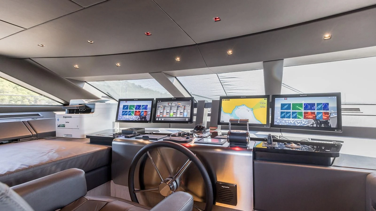 a room with computers and monitors aboard JICJ Yacht for Sale
