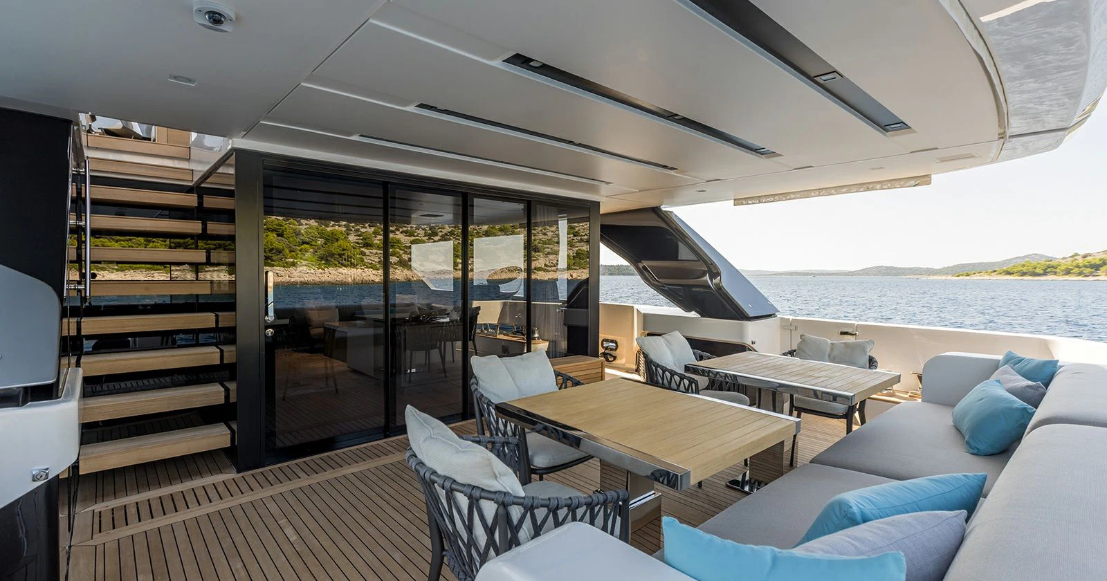 a room with a table and chairs aboard JICJ Yacht for Sale