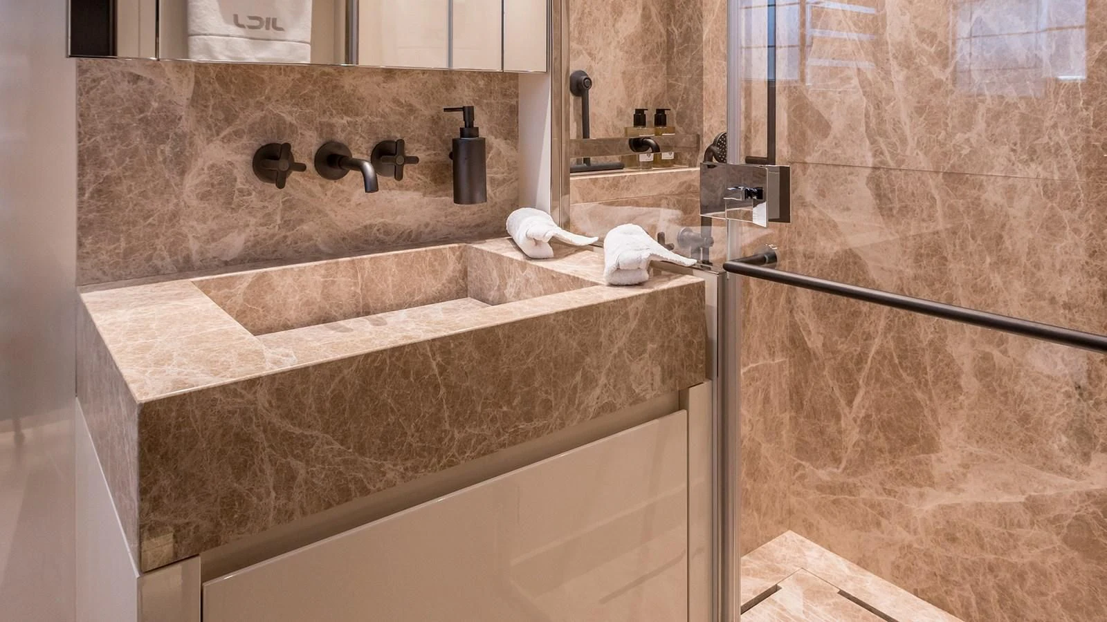 a bathroom with a marble counter top aboard JICJ Yacht for Sale