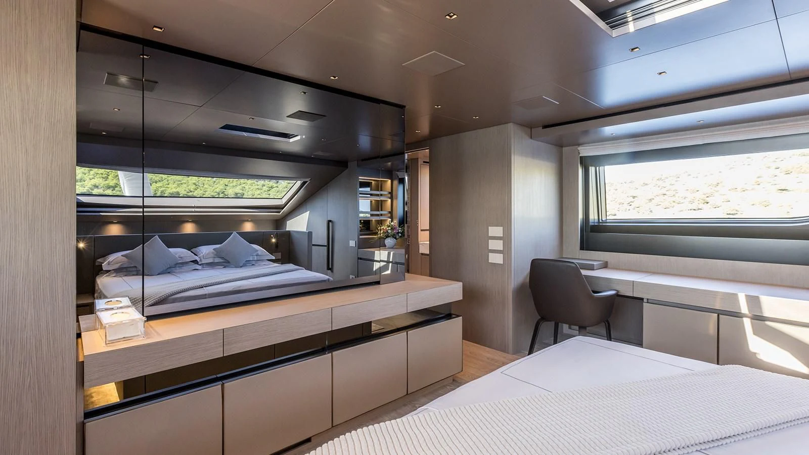 a room with a bed and a chair aboard JICJ Yacht for Sale