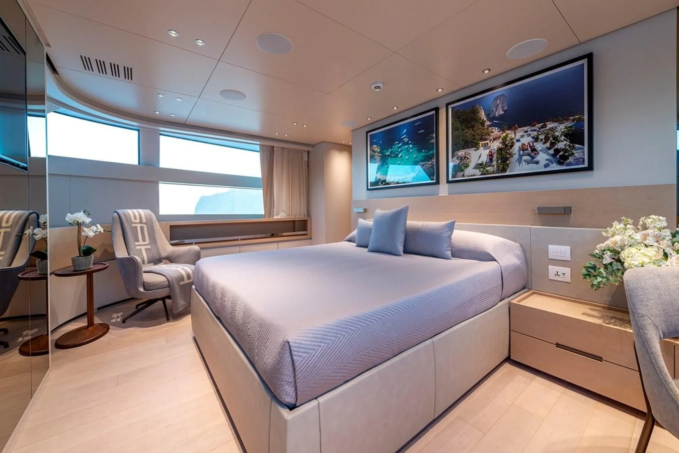 a bedroom with a bed and a table aboard JICJ Yacht for Sale