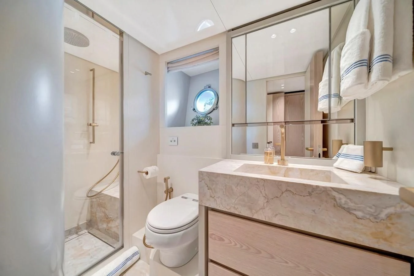 a bathroom with a large mirror aboard JICJ Yacht for Sale