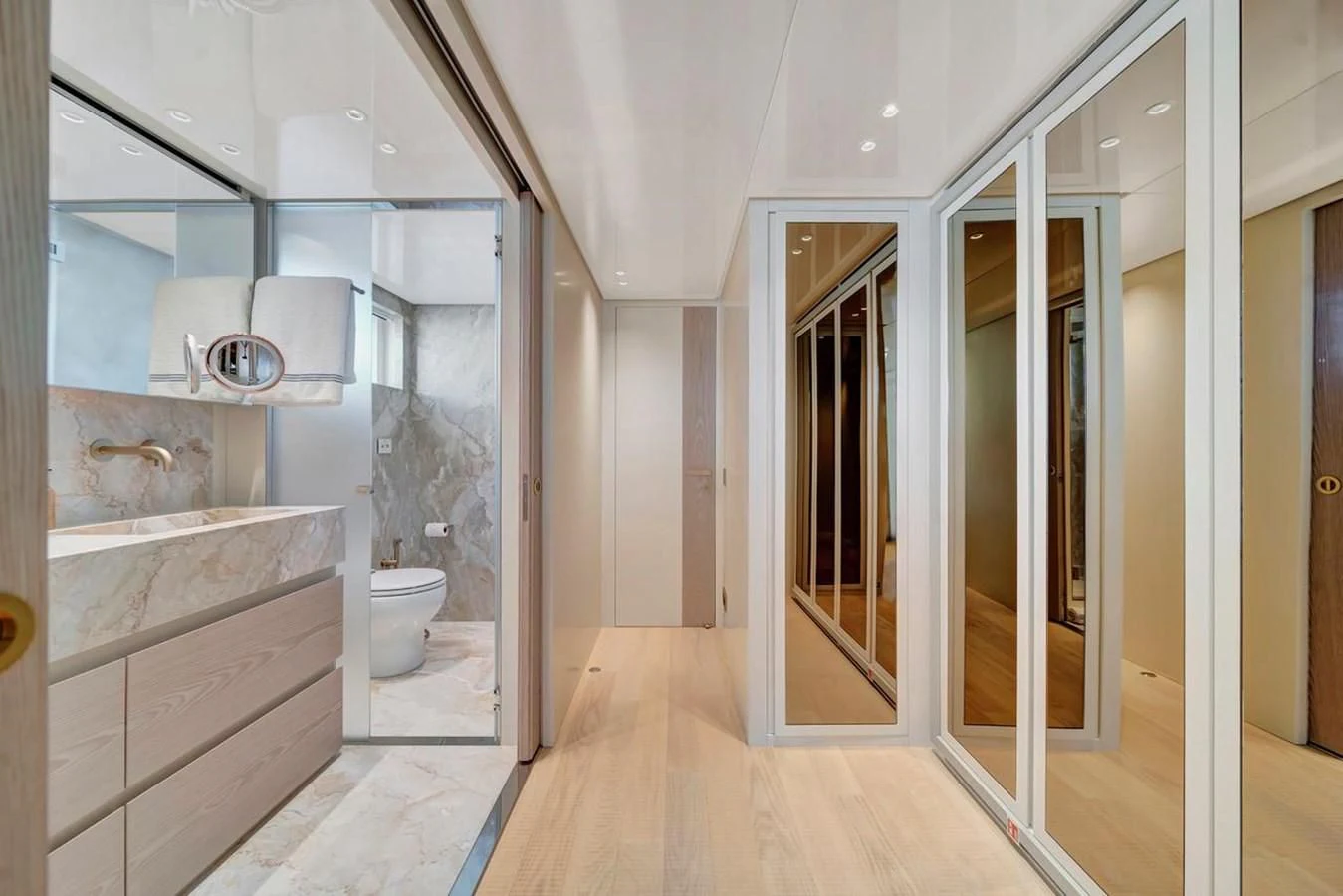 a bathroom with a glass shower aboard JICJ Yacht for Sale