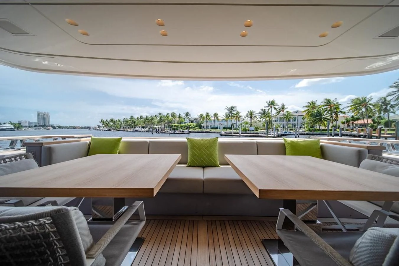 a room with tables and chairs aboard JICJ Yacht for Sale