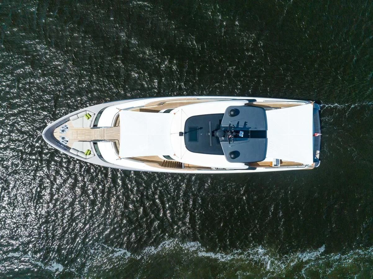 a white boat in the water aboard JICJ Yacht for Sale