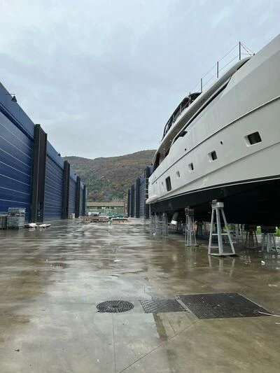 a boat docked in a harbor aboard JICJ Yacht for Sale