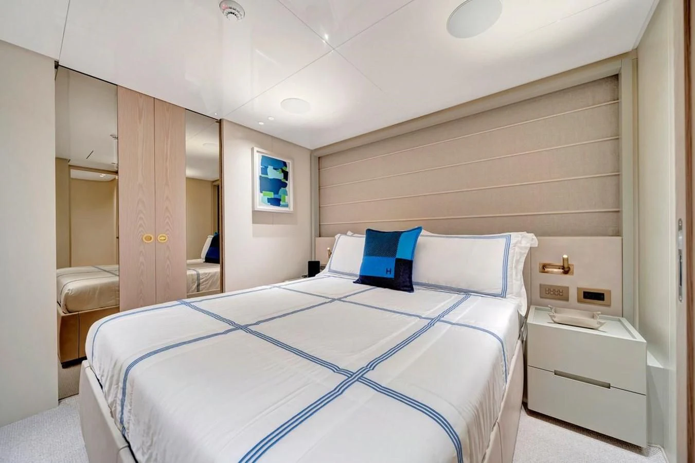 a bedroom with a bed and a desk aboard JICJ Yacht for Sale