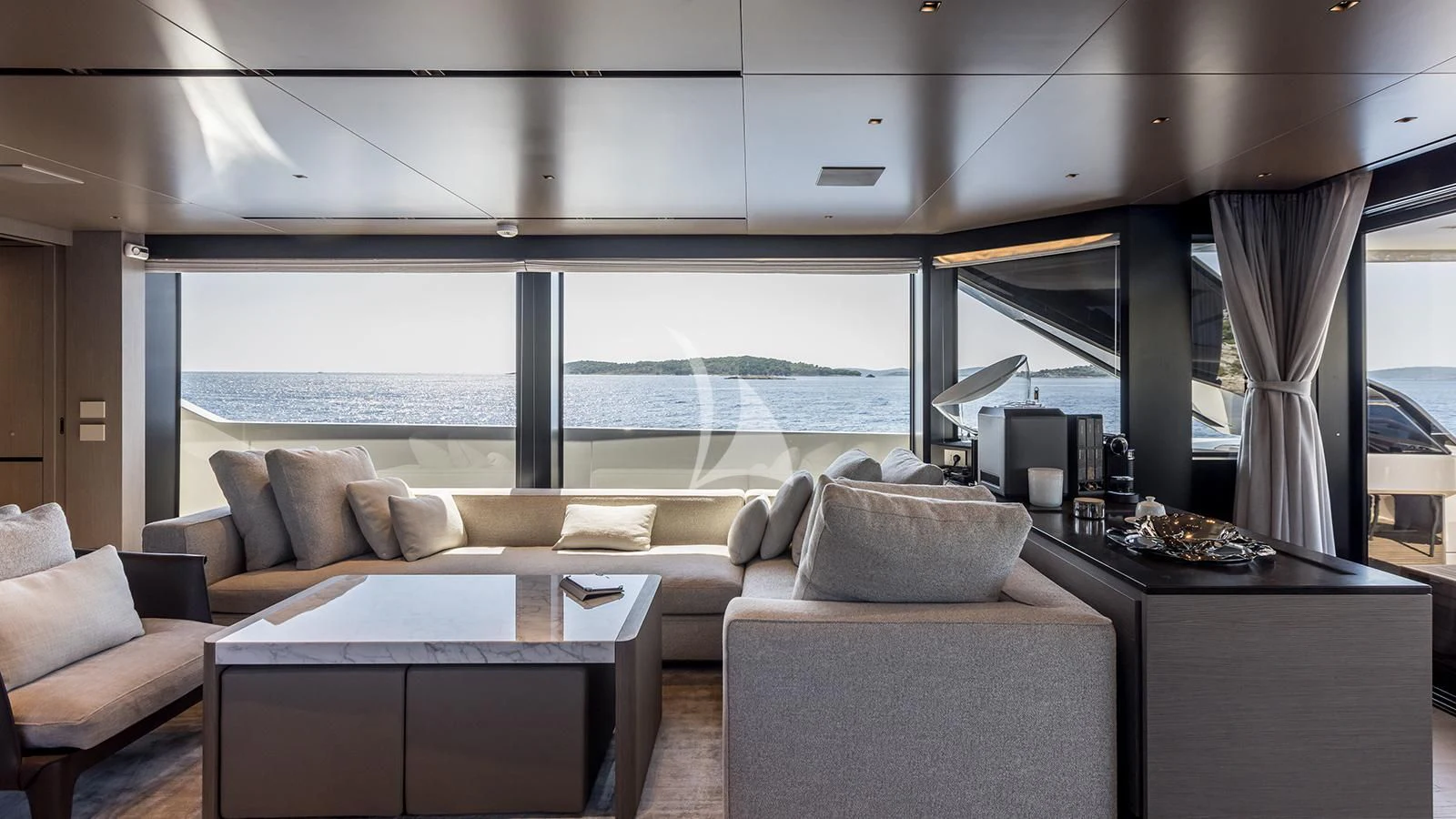 a living room with a large window aboard JICJ Yacht for Sale