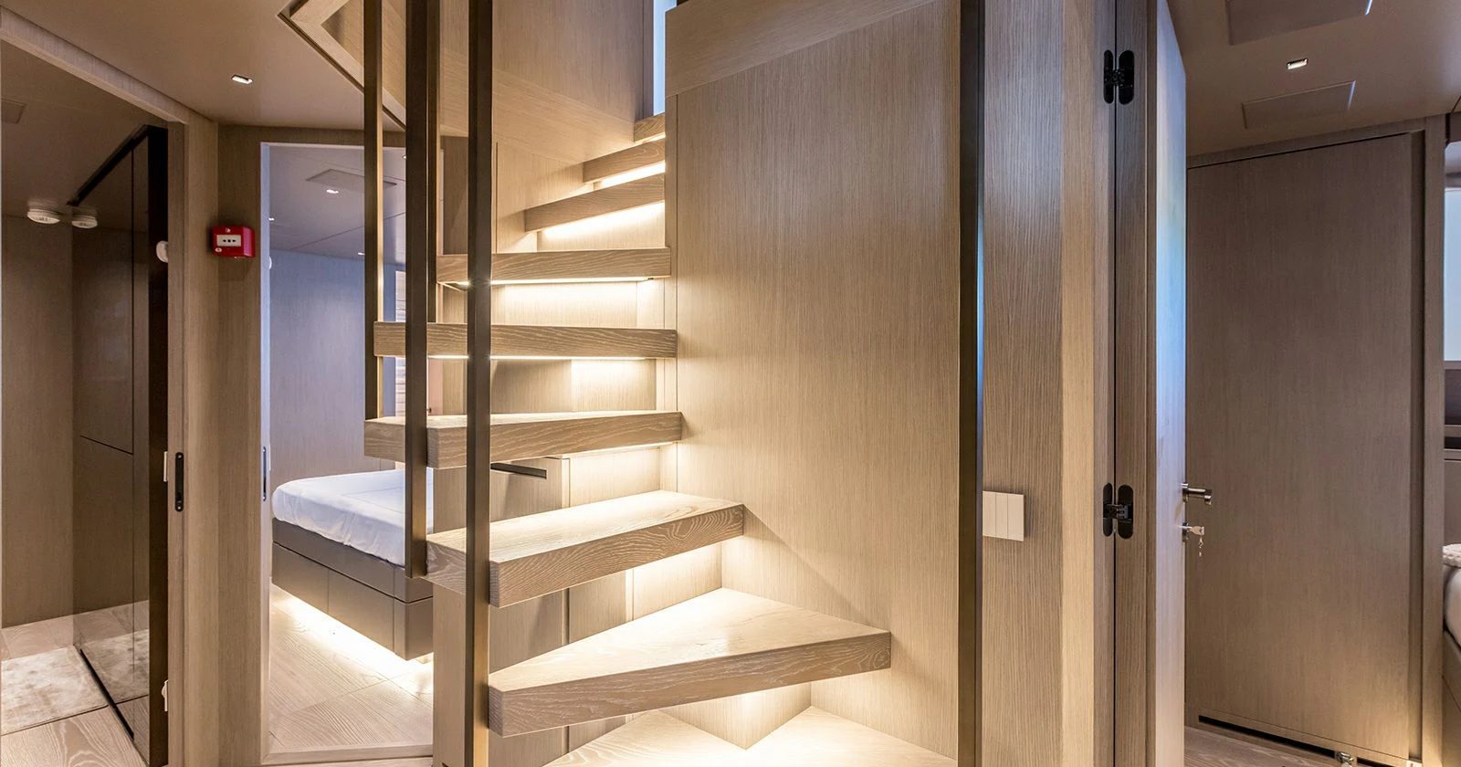 a room with a staircase and a glass door aboard JICJ Yacht for Sale