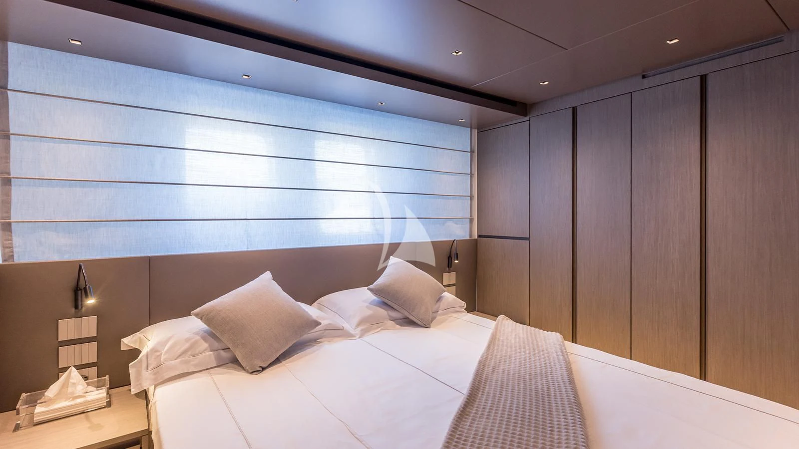 a bed with white sheets aboard JICJ Yacht for Sale