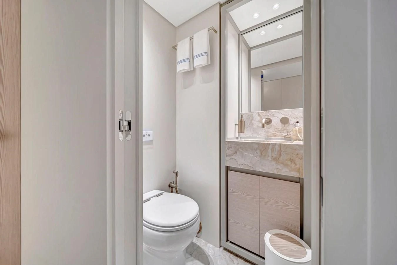 a bathroom with a toilet and a sink aboard JICJ Yacht for Sale