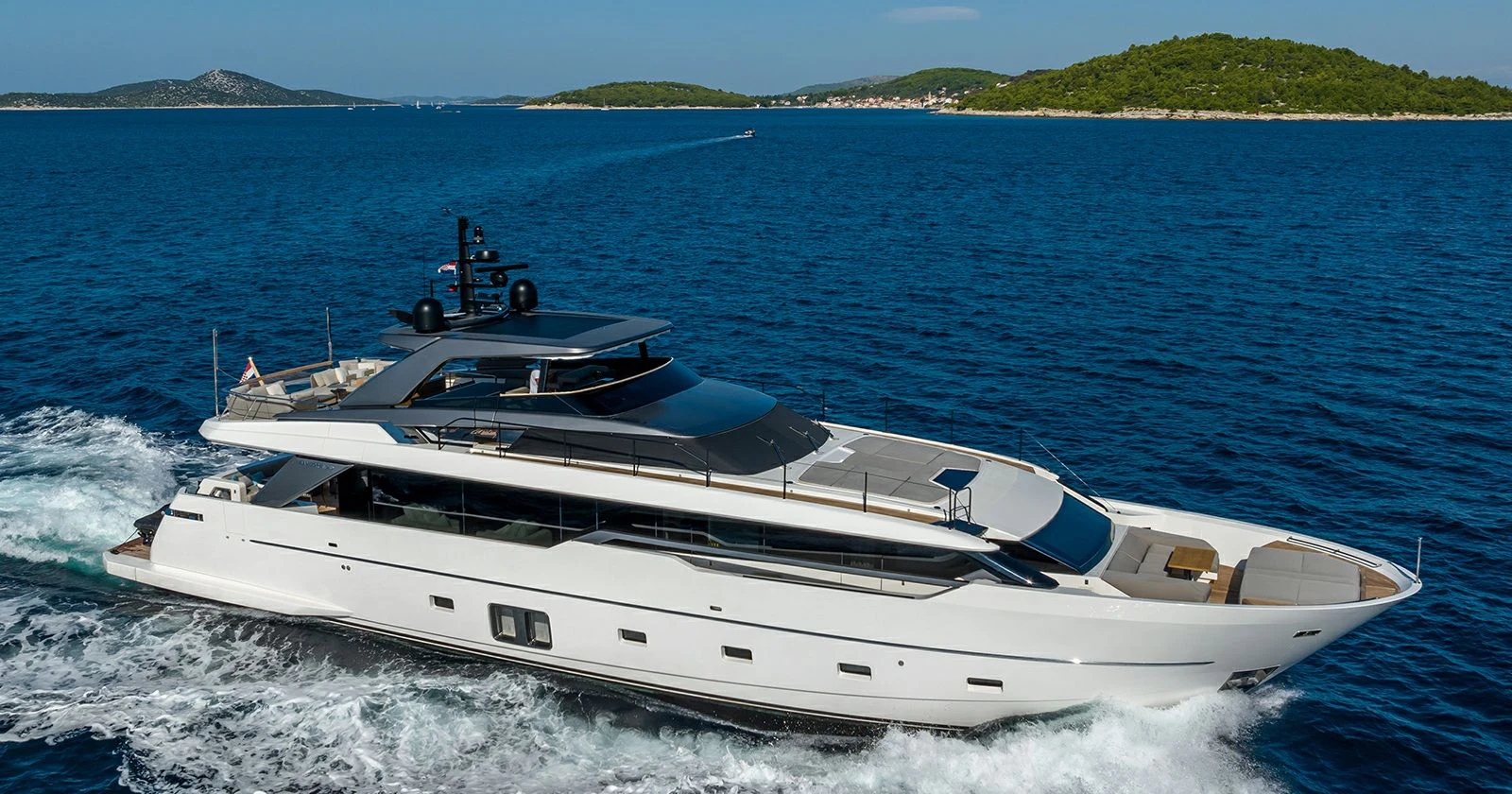 a white yacht on the water aboard JICJ Yacht for Sale