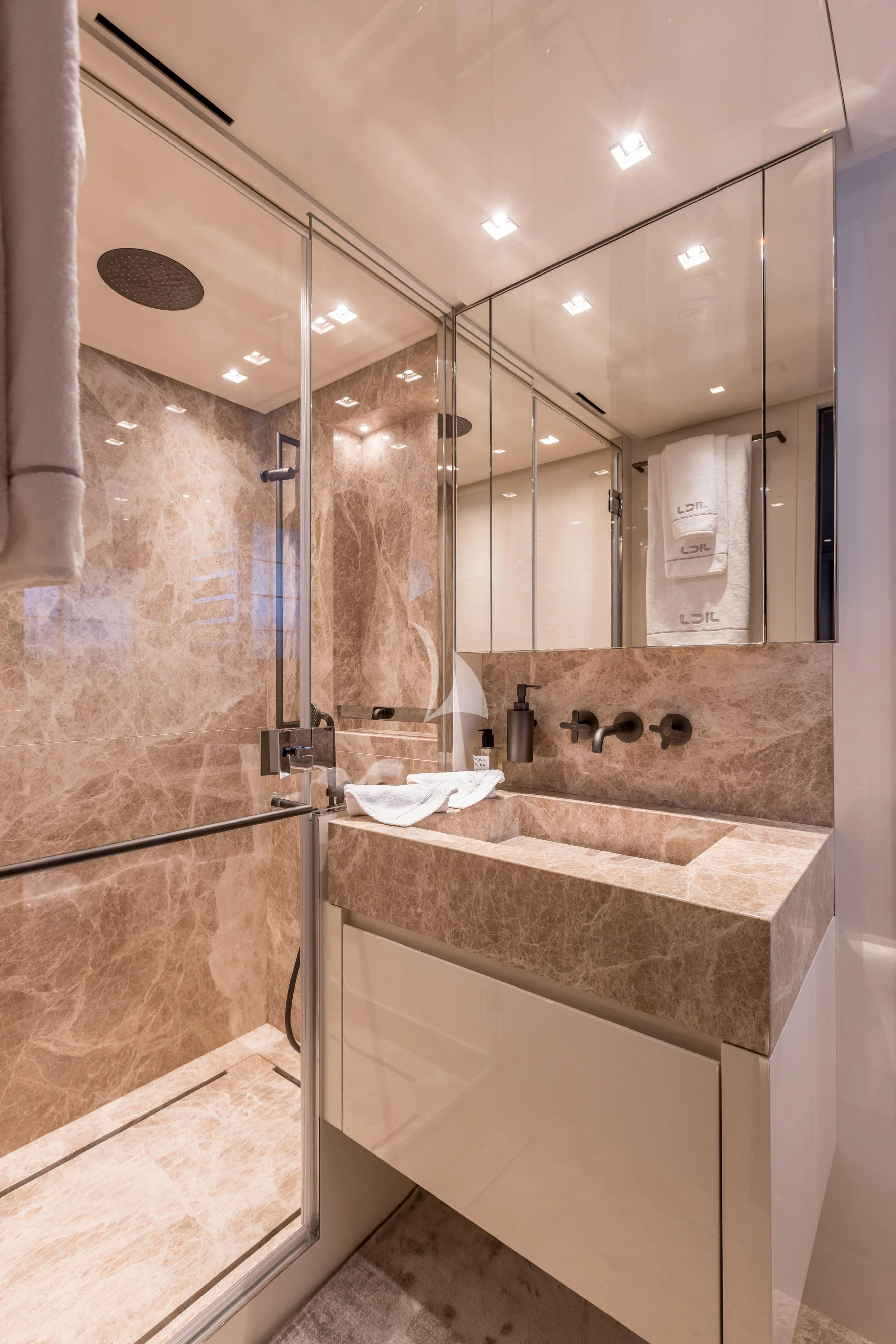 a bathroom with marble counter tops aboard JICJ Yacht for Sale