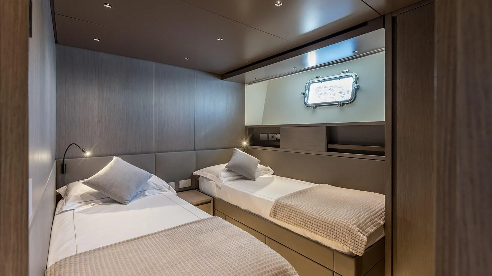 a room with a couple of beds aboard JICJ Yacht for Sale
