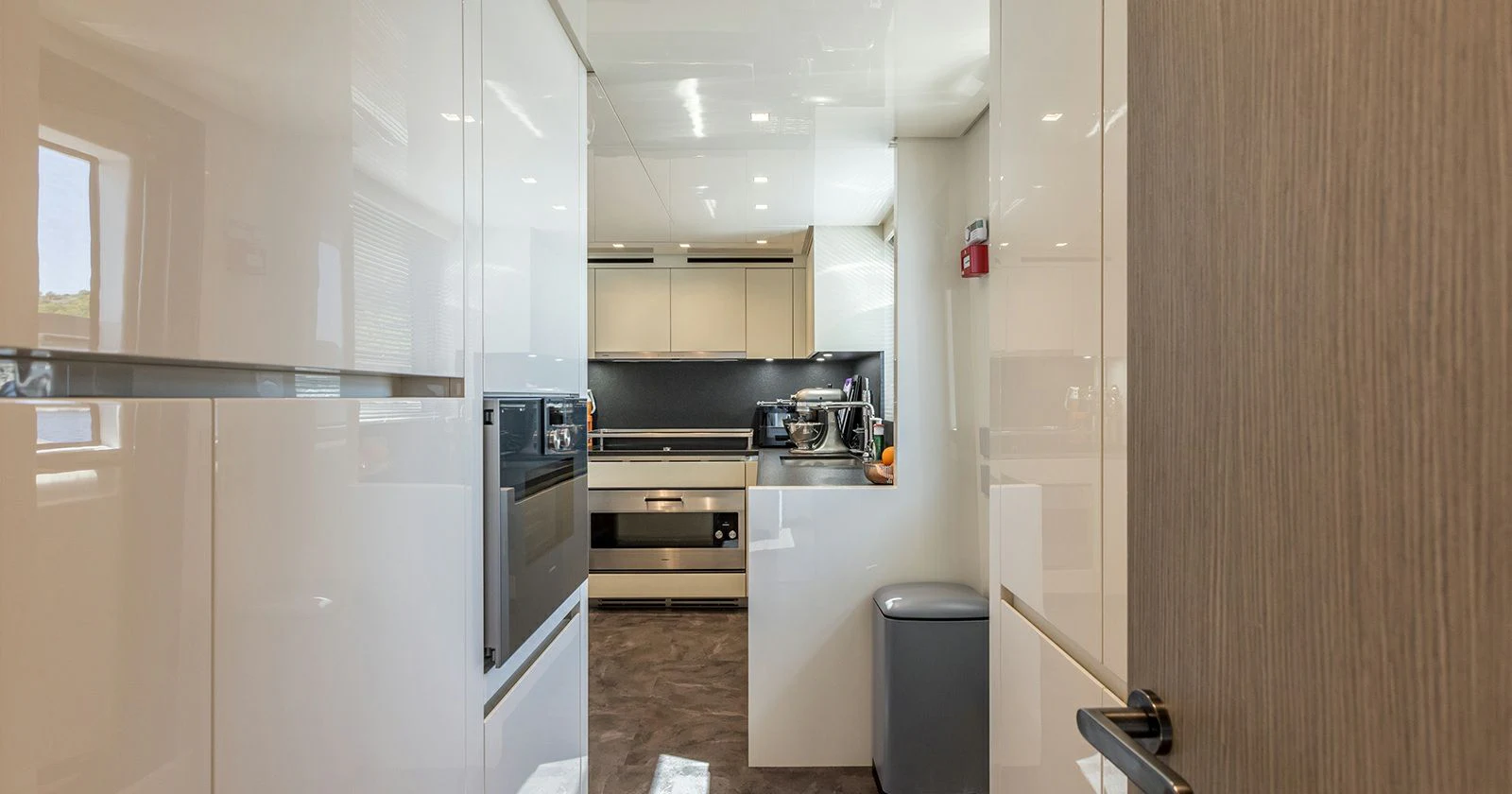 a kitchen with white cabinets aboard JICJ Yacht for Sale