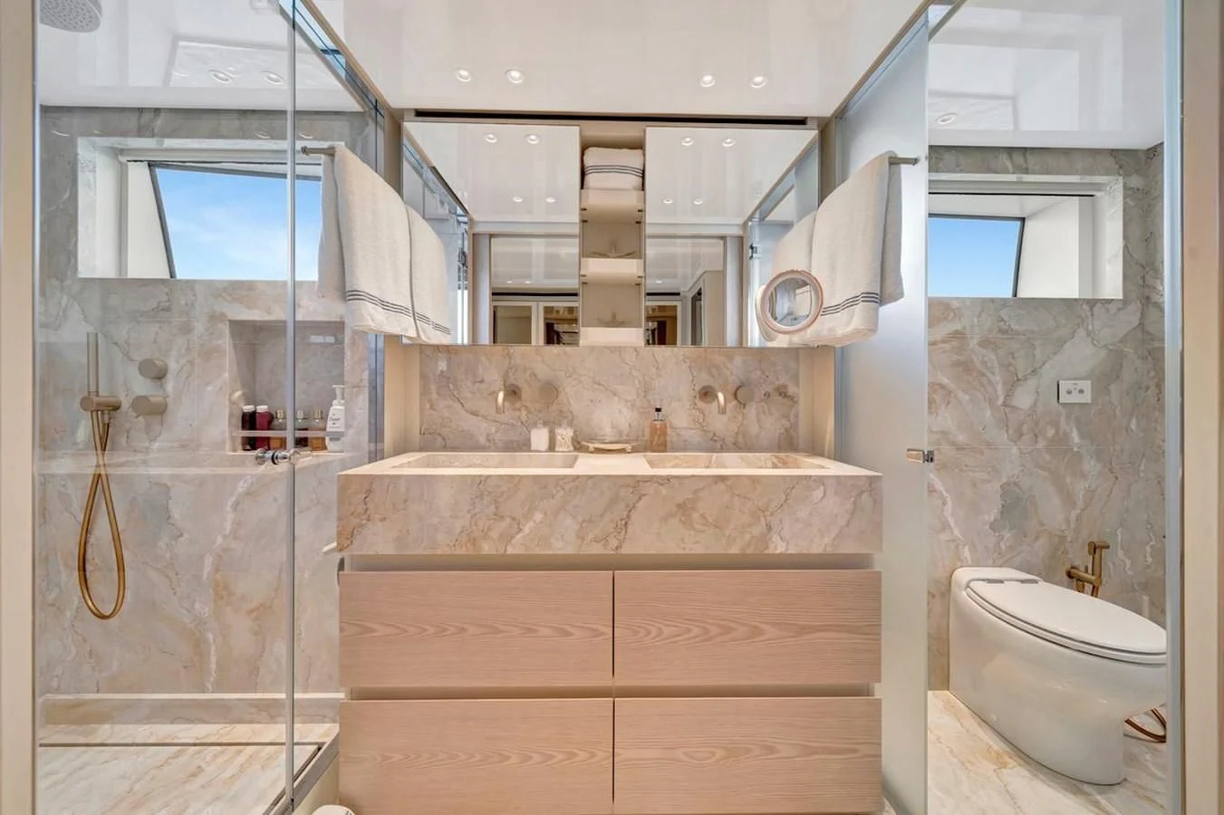 a bathroom with a marble counter top aboard JICJ Yacht for Sale