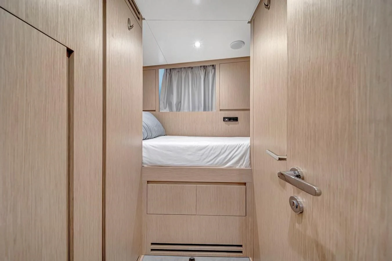 a room with a bed and a closet aboard JICJ Yacht for Sale