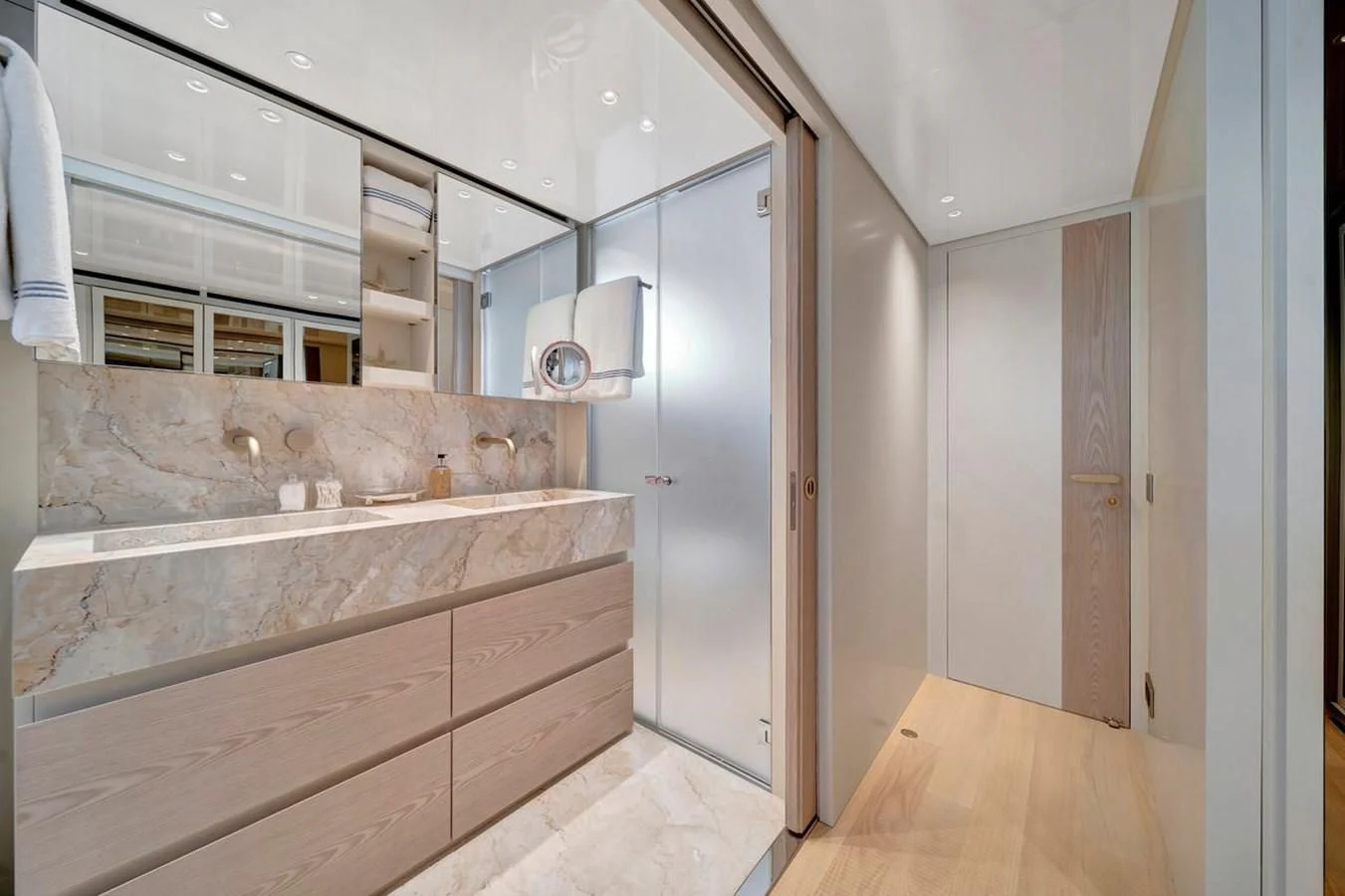 a bathroom with a marble countertop aboard JICJ Yacht for Sale