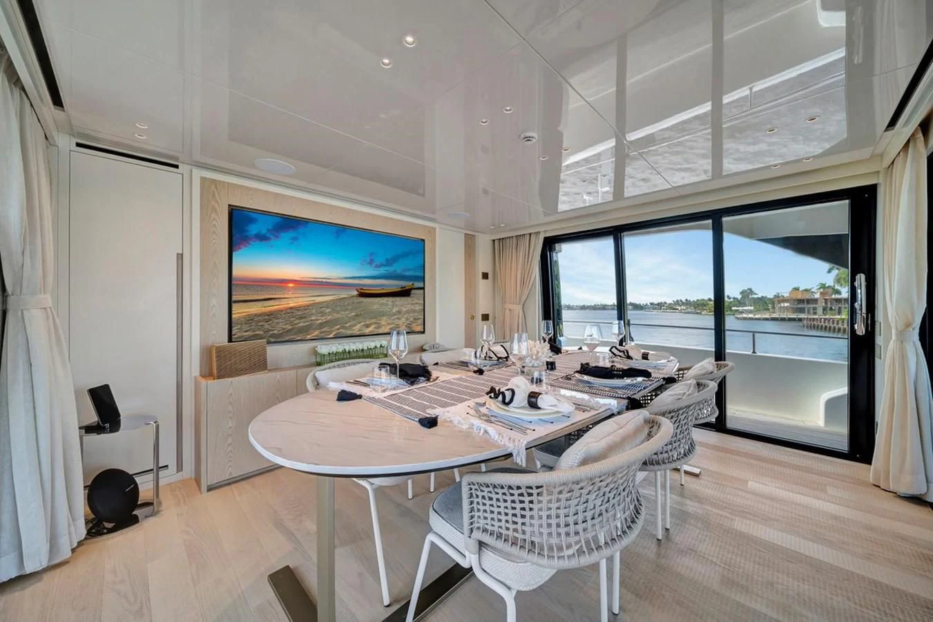 a room with a table and chairs aboard JICJ Yacht for Sale