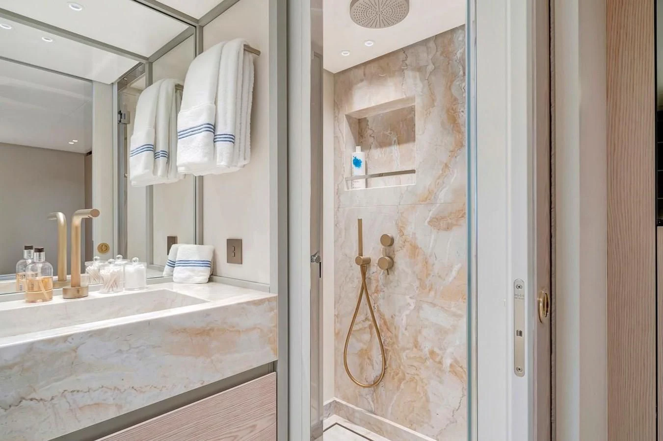a bathroom with a large mirror aboard JICJ Yacht for Sale