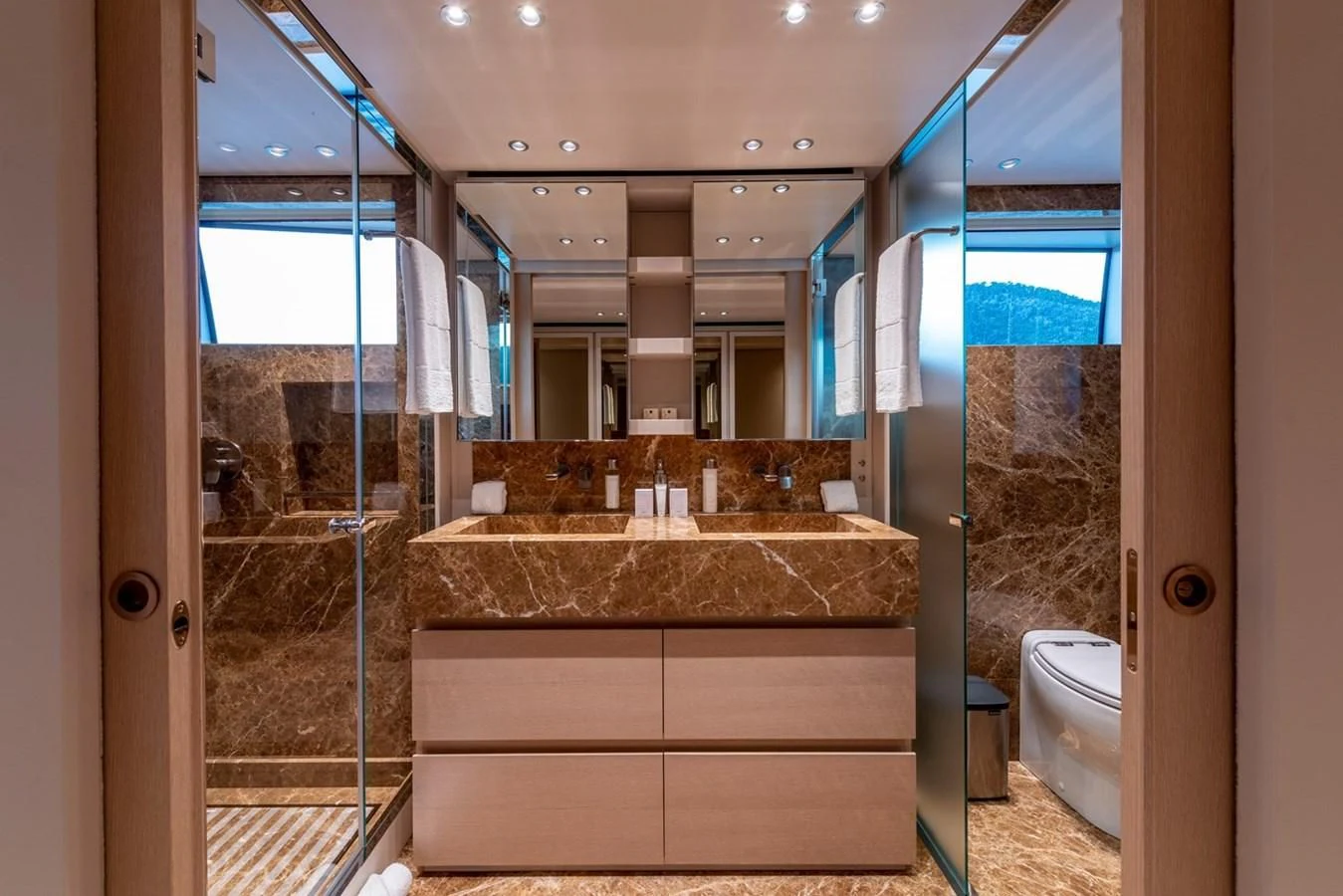 a bathroom with a marble counter aboard JICJ Yacht for Sale