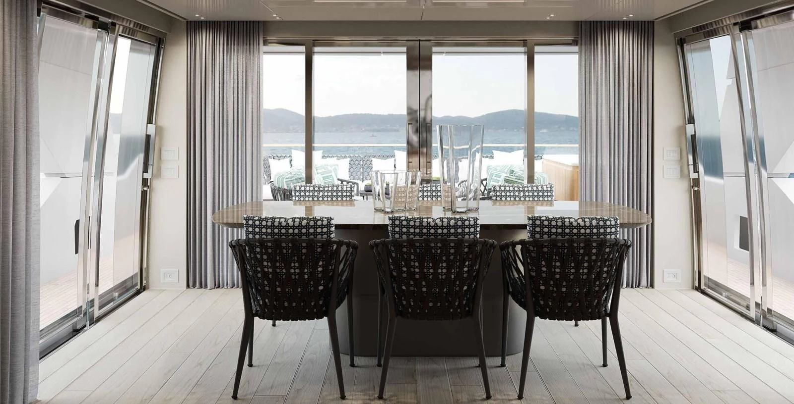 a room with a table and chairs aboard JICJ Yacht for Sale