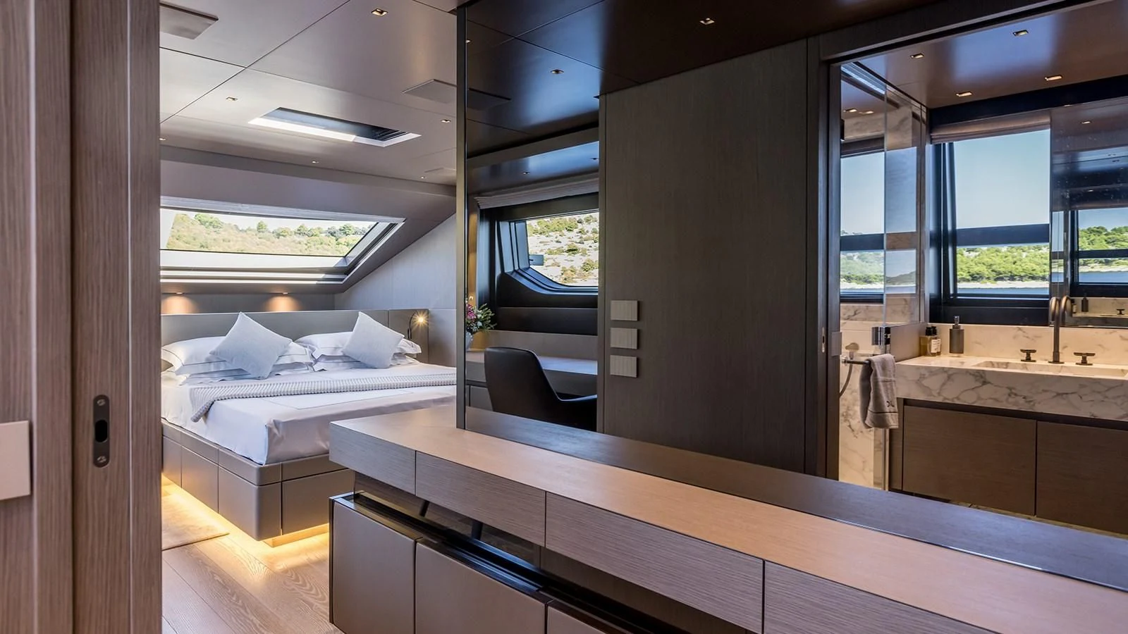 a room with a bed and a couch aboard JICJ Yacht for Sale